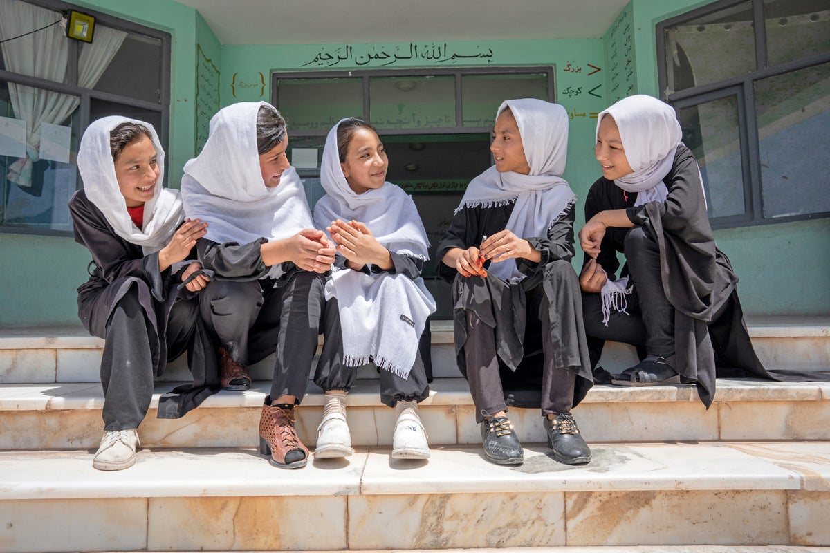 girls sit together at school