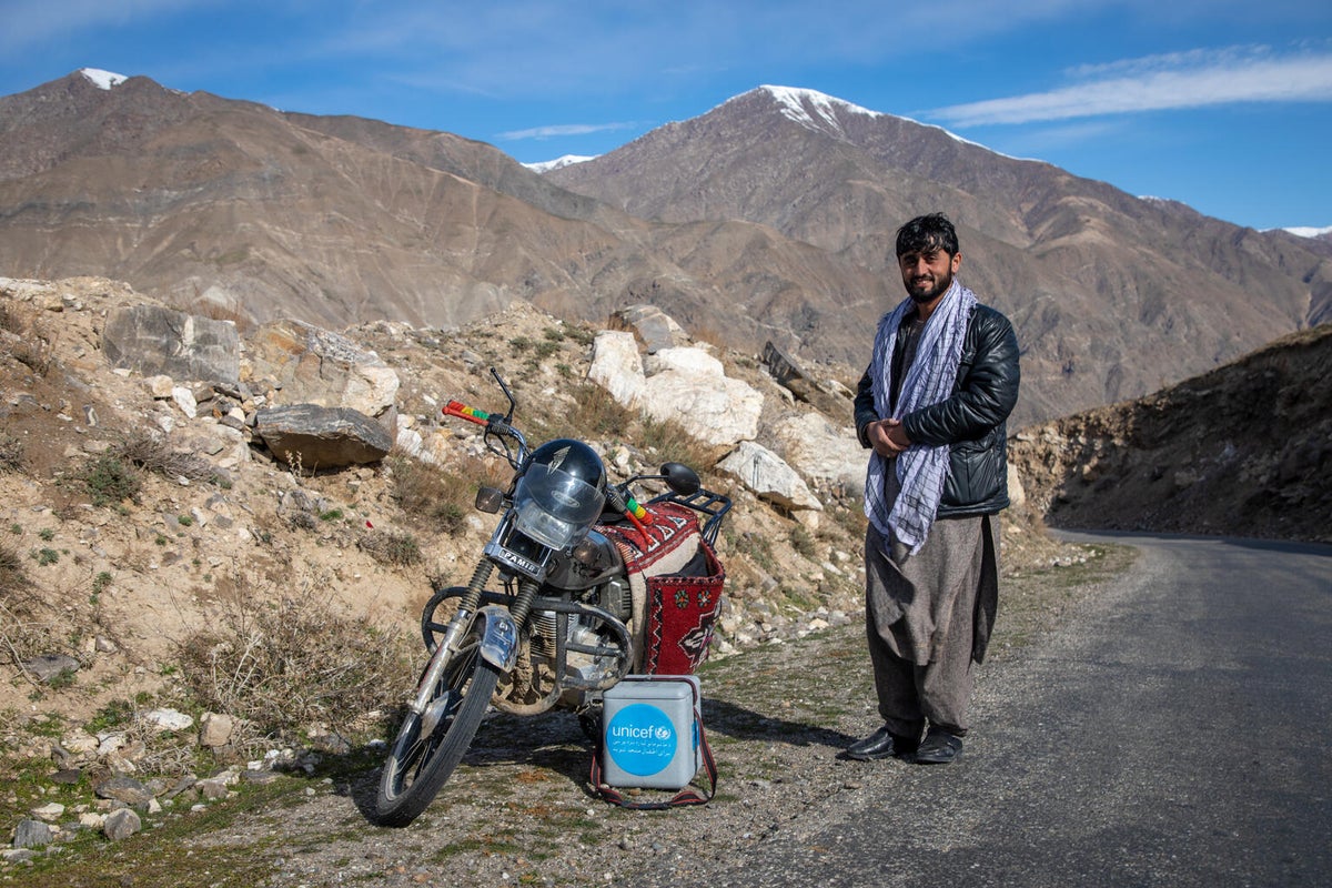 A man and his motorbike en-route to a remote village in Afghanistan.