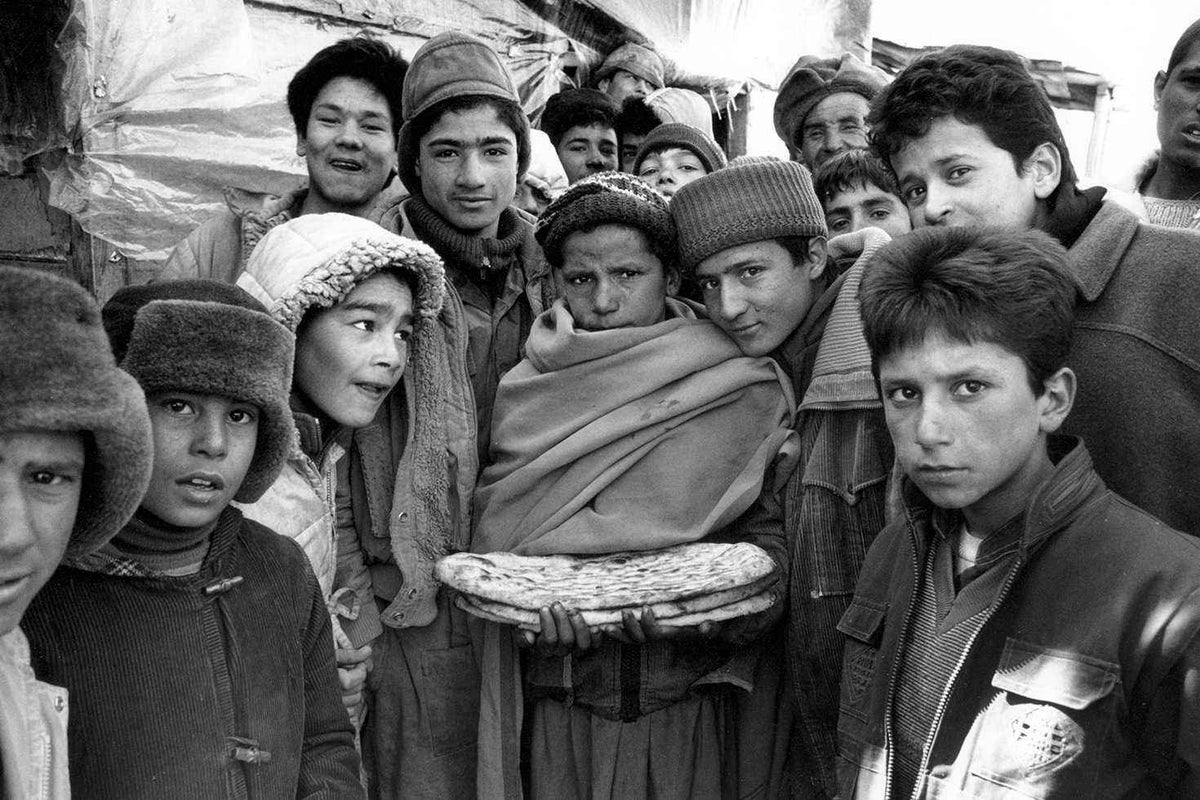 Boys gather for a bread distribution in Kabul, in 1992.