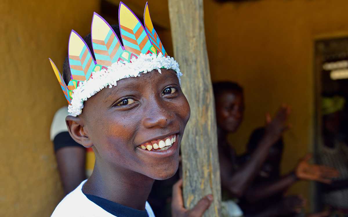 Sanfa smiles during a community meeting on Ebola. 