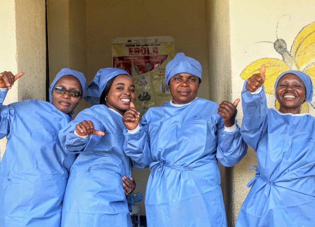 Health workers; Florida, Gisèle, Mamisa and Kitambala celebrate the end of the Ebola epidemic.