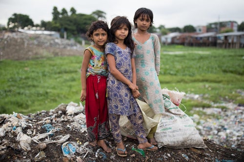 Three young girls pose to the camera.