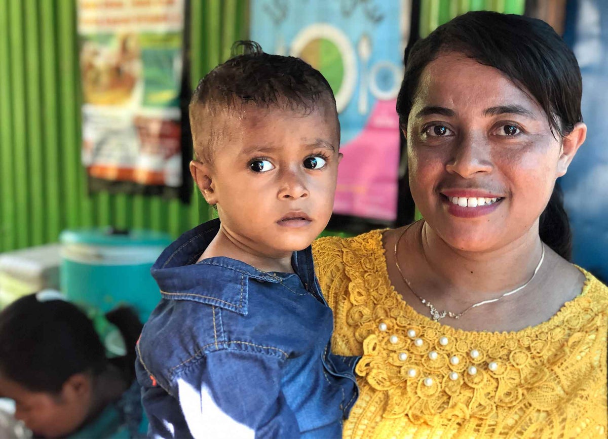 Karno, here with his mother Esi, is now happy and healthy after recovering from malnutrition
