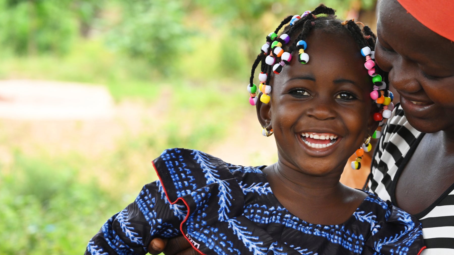 A happy girl in a village in the South of Cote d’Ivoire