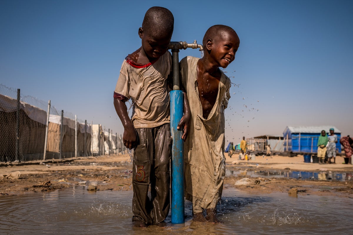 Boys playing in water in Nigeria