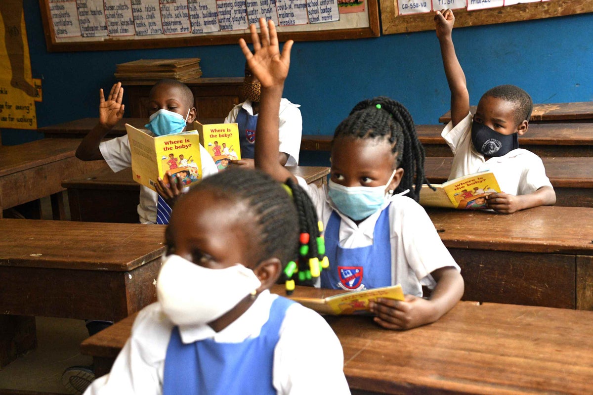 Child in classroom in Uganda