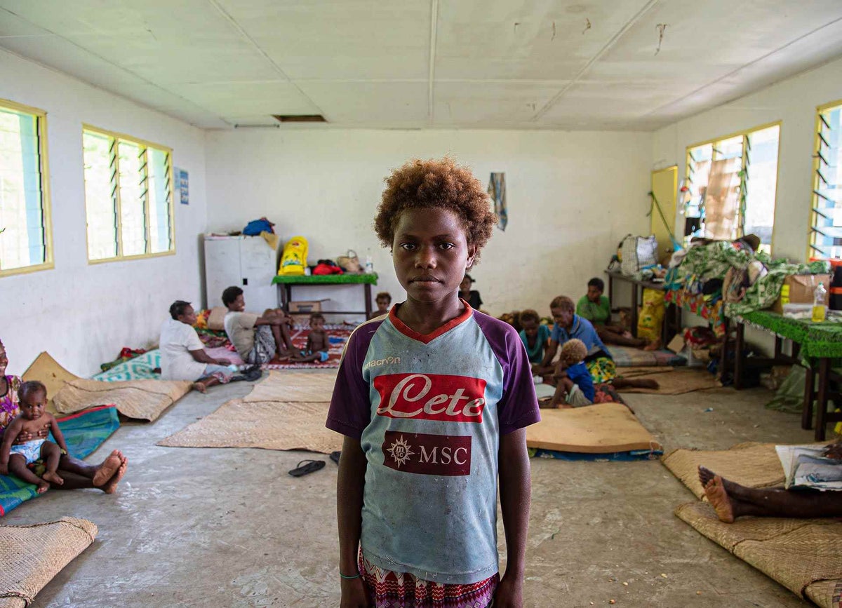 Seraphine, 9, and her family have been living in this classroom, with other families since Tropical Cyclone Harold destroyed their homes