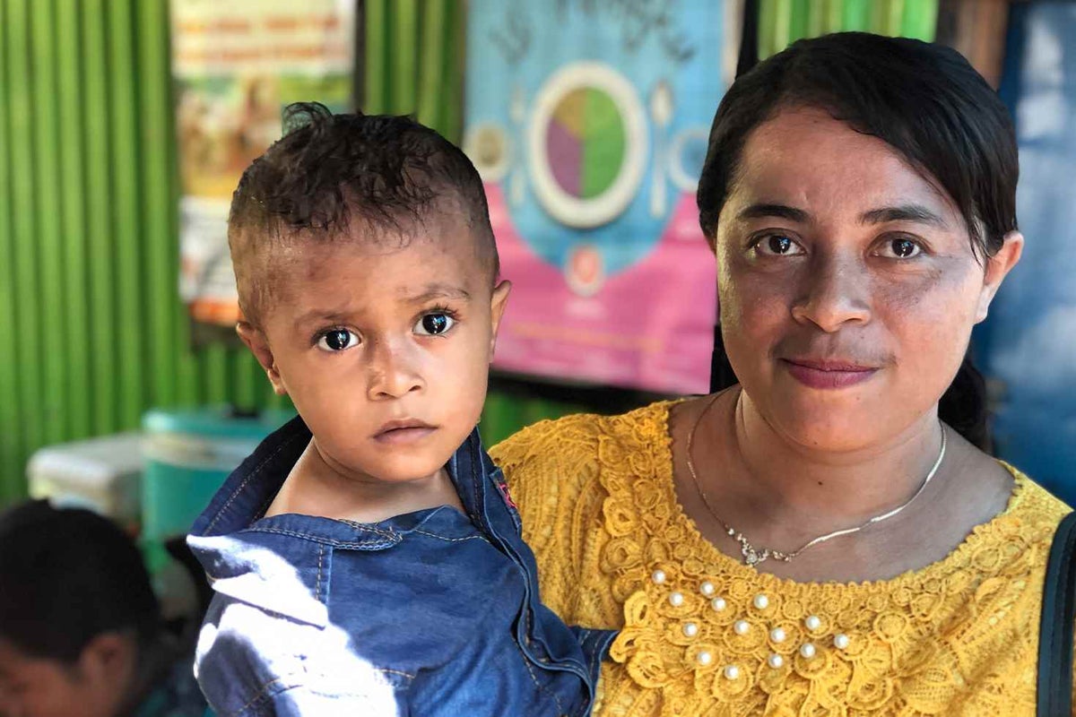Karno with his mother, Esi.