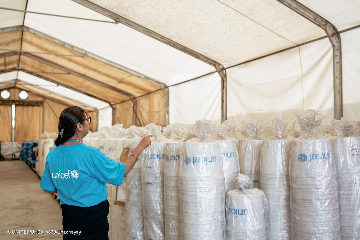 UNICEF staff load pre-positioned hygiene kits for delivery to flood-affected communities in Rasuwa and Nuwakot to support children and families affected by the devastating floods.