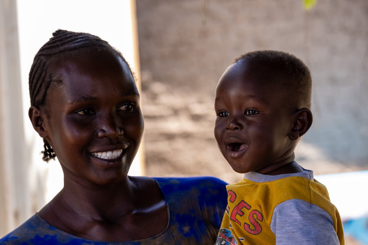 A woman holds her son in the nutrition ward of a healthcare centre in South Sudan.