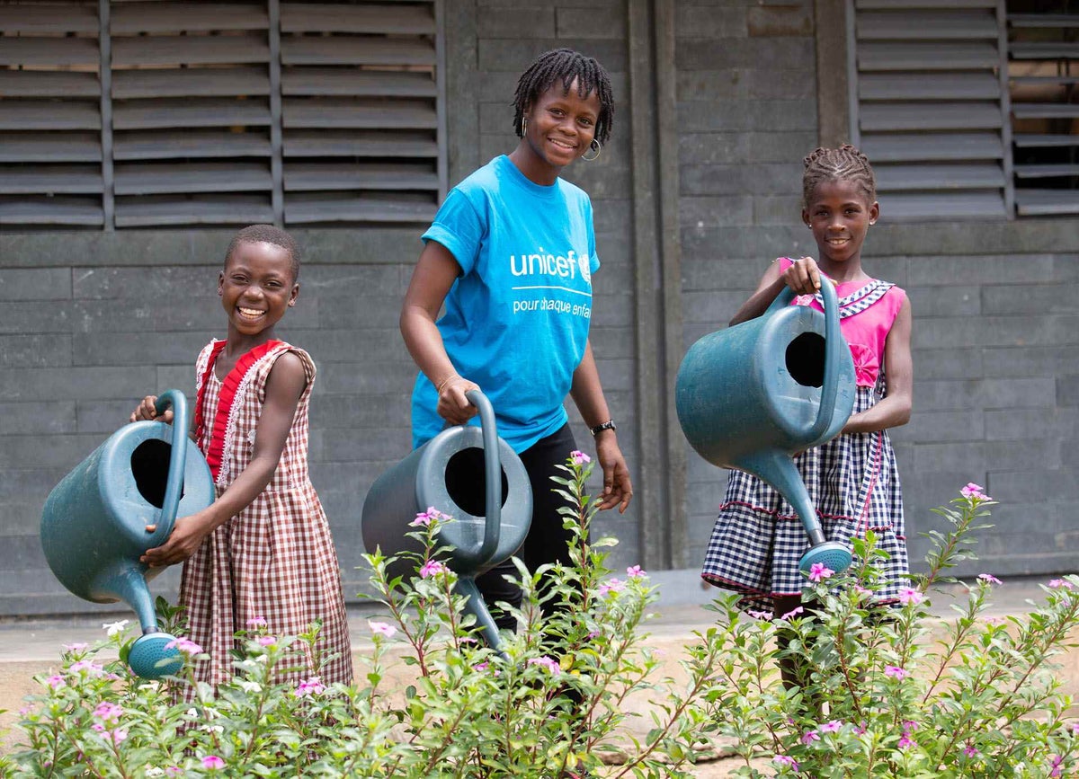 Children look after plants and learn how to wash their hands at their school in Côte d’Ivoire.