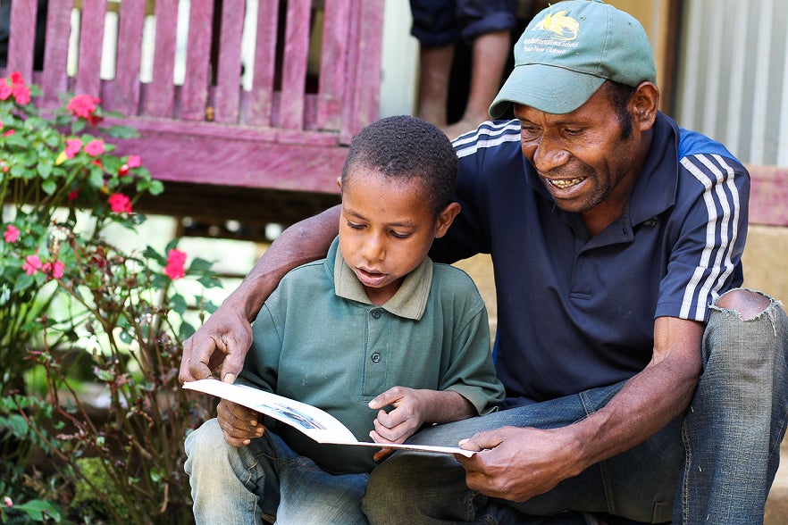 Father and son reading