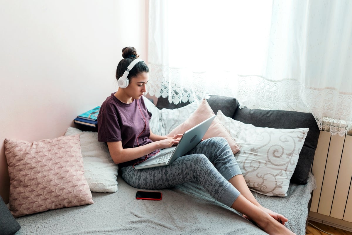 Girl sitting on her computer