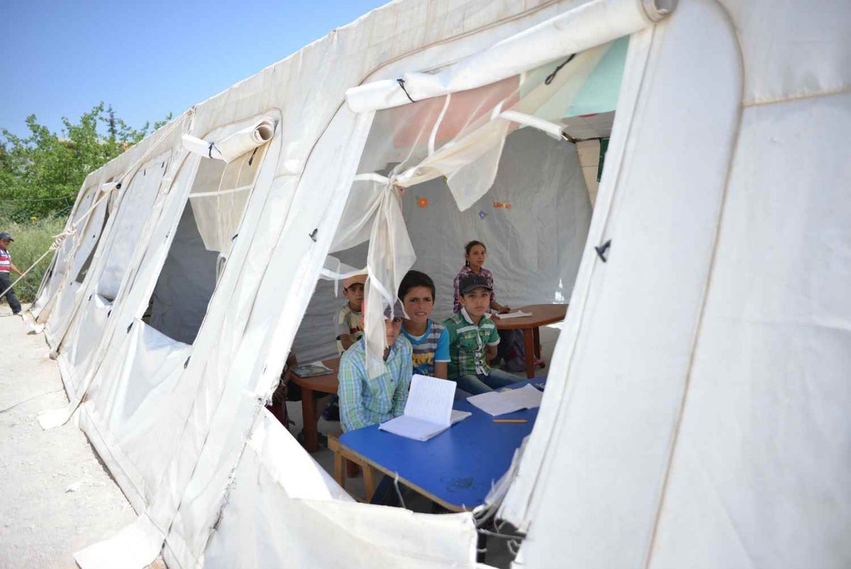 Large marquees serve as temporary classrooms for children of all ages, from as young as two, up to the age of 15. In summer, they’re stifling hot and in winter, often blanketed in snow. 