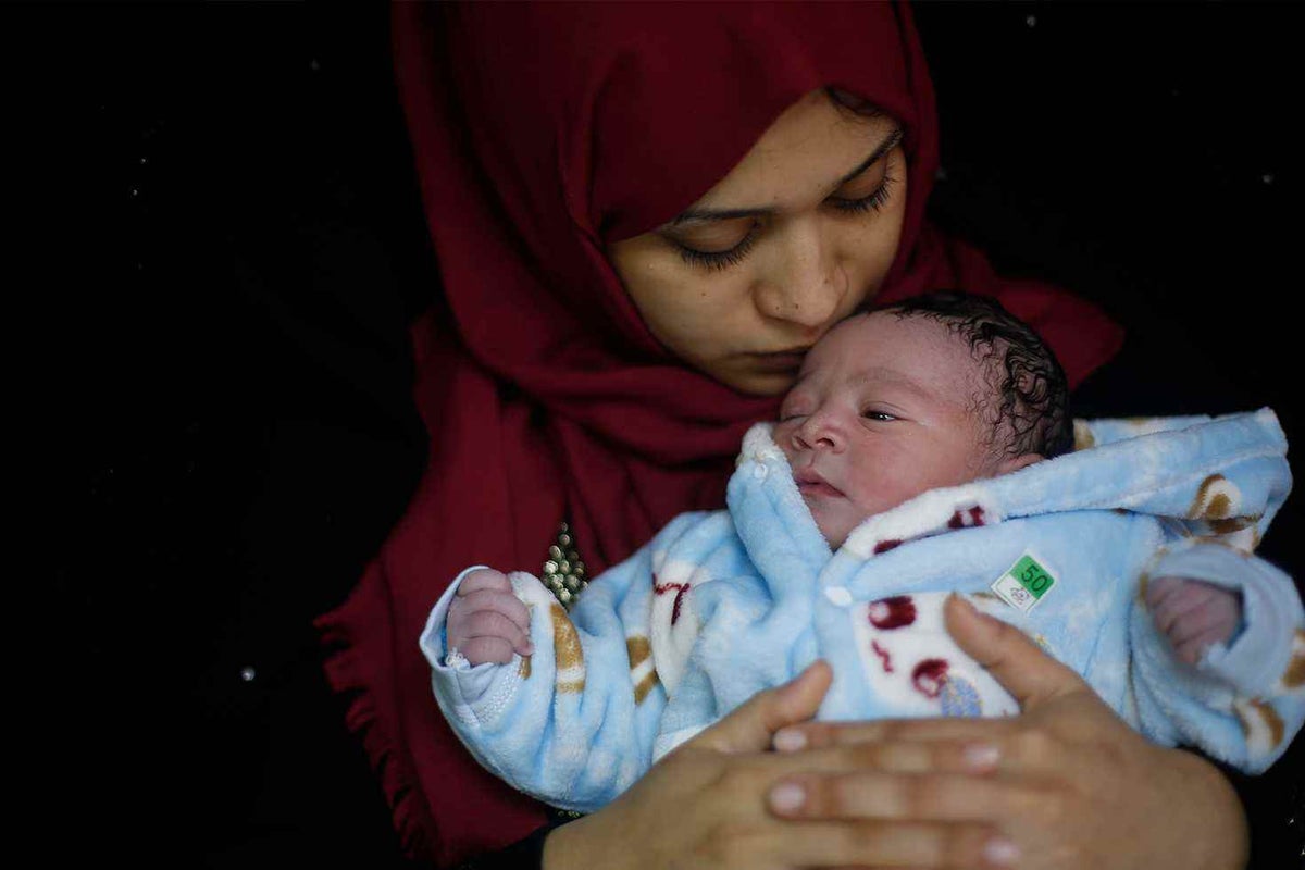 Mother Samia and her newborn baby boy, Mohammed, at Al Shifaa hospital in Gaza City. 