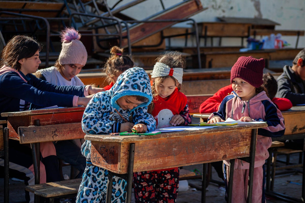 Children who lost their homes in the earthquakes participate in activities provided by UNICEF-supported volunteers in northwest Syria.