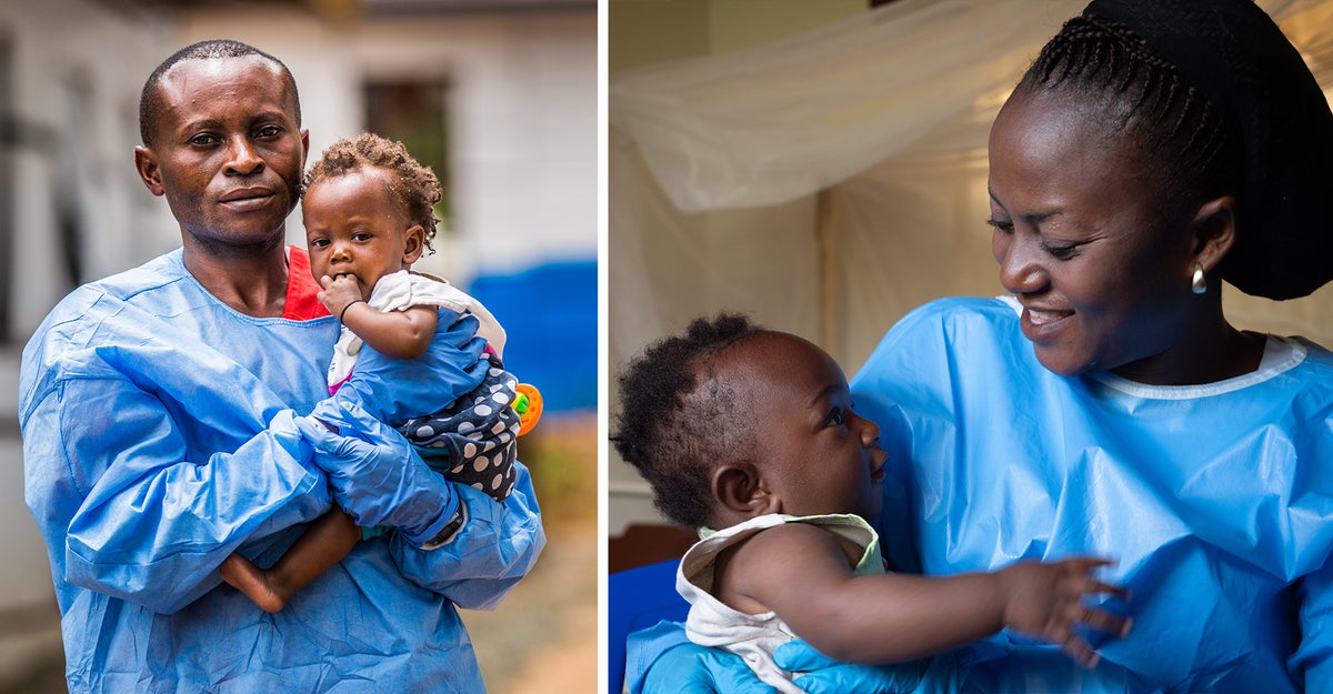 Two children who survived Ebloa. Held in the arms of their parents.