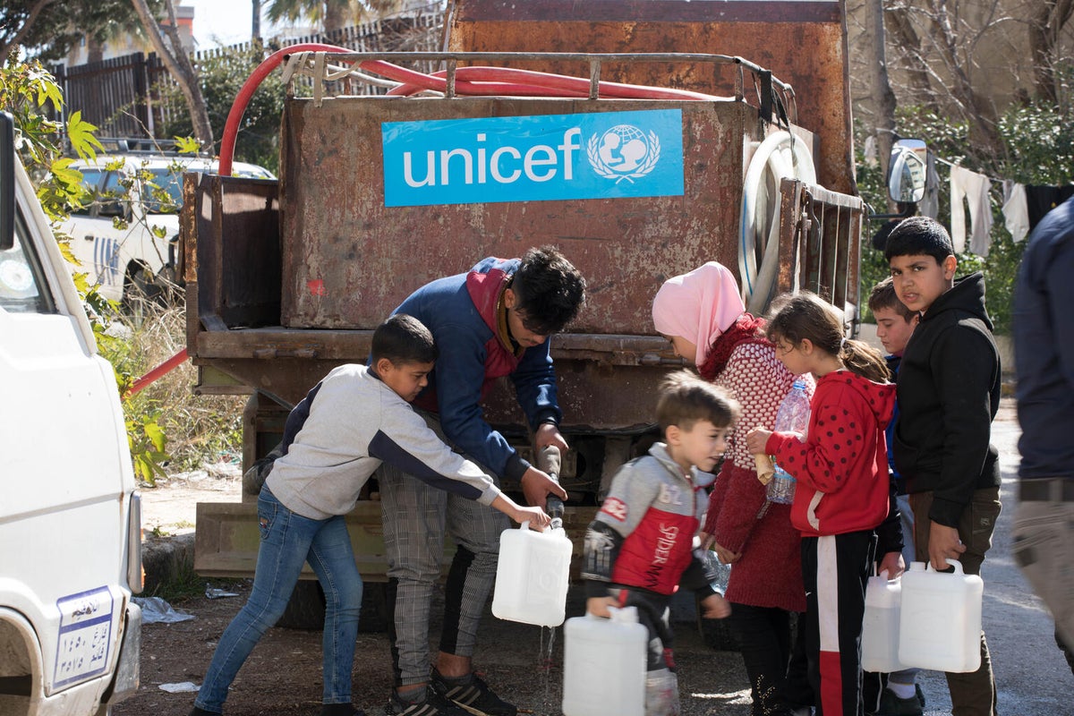 On 20 February 2023, as dozens of families displaced by the Türkiye and Syria earthquakes sheltered at a centre in Syria, children filled water jugs at a UNICEF-provided water truck. 
