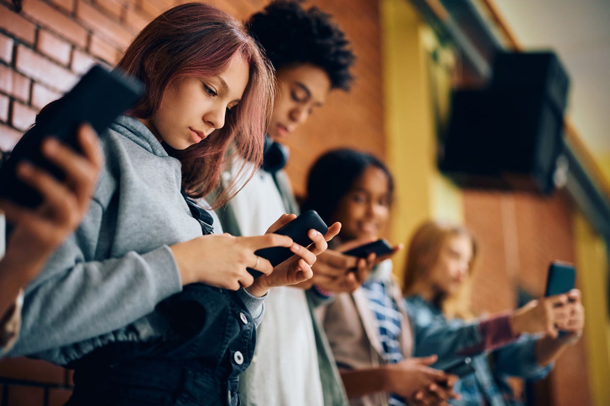 Teenagers on their devices