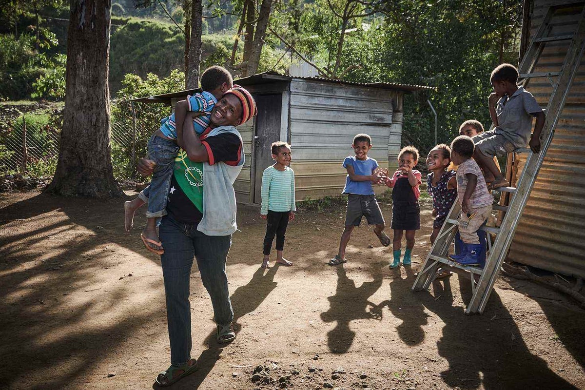 Wasna playing with her son Nick, 4, and neighbouring children.