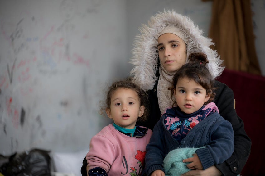A mother with her two children after the earthquakes in Türkiye and Syria.