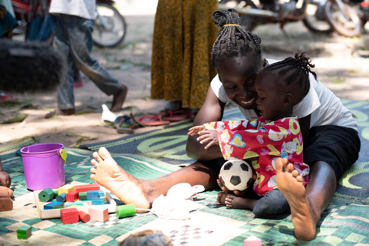 Jenty and Margret are playing in the play area at the UNICEF supported nutrition centre in Yambio.