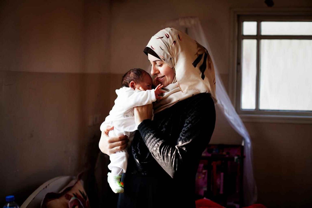 Safa Manasra with her first child Asil in Shejaiya, Palestine, in 2014. 