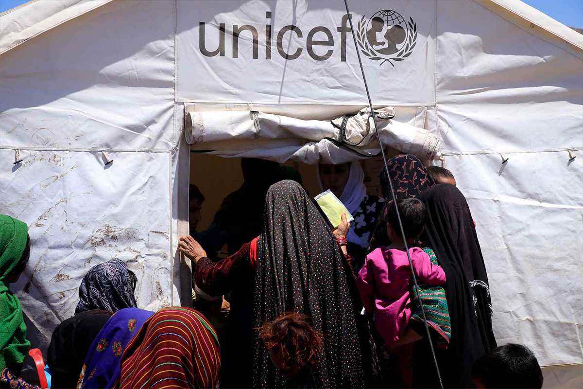 Line outside of medical clinic in tent