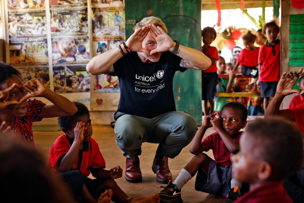 Ronan Keating plays “Simon Says” with teachers and children.