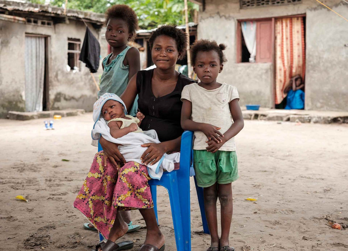 Mama Bwanga, 25, has bought her sons, Dieu, one month, and Mélé, seven, to a health clinic to be vaccinated against measles. Her daughter Raissa (left), 10, has already been vaccinated. 