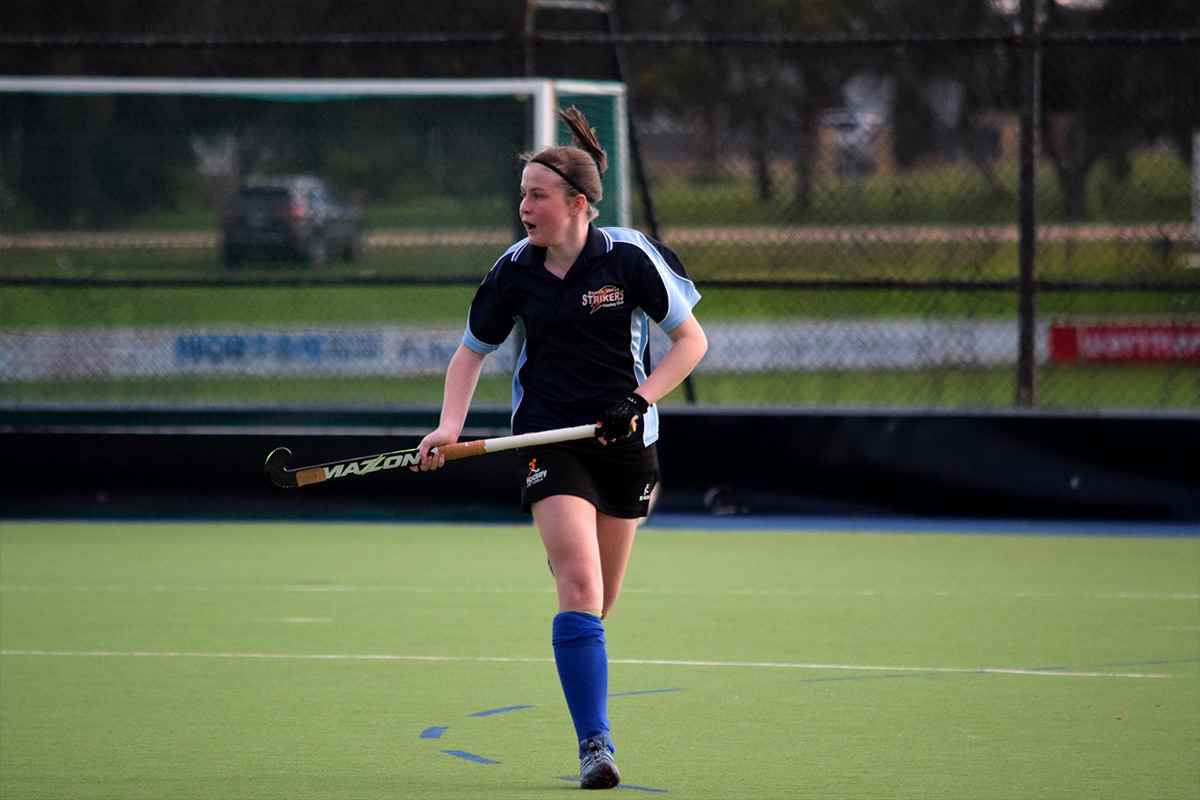 UNICEF Young Ambassador Emily plays hockey in country Victoria prior to the lockdowns.