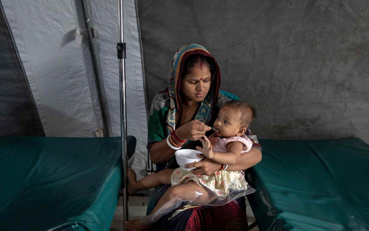 A mother cares for her baby at a makeshift medical facility in the Cox's Bazar camps.