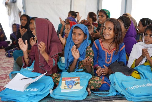 Children attend a class at the temporary learning centre established by UNICEF in a camp for flood-affected people in Pakistan.