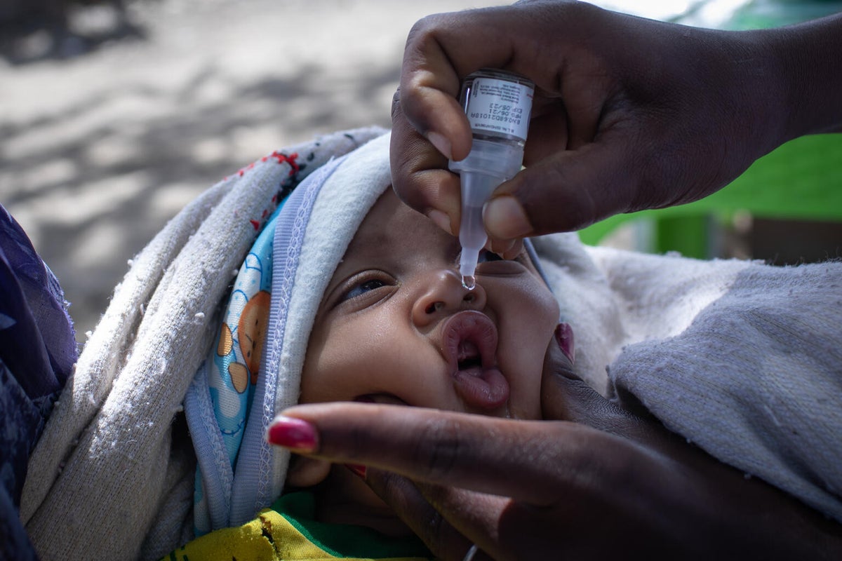 A baby is give a droplet vaccine