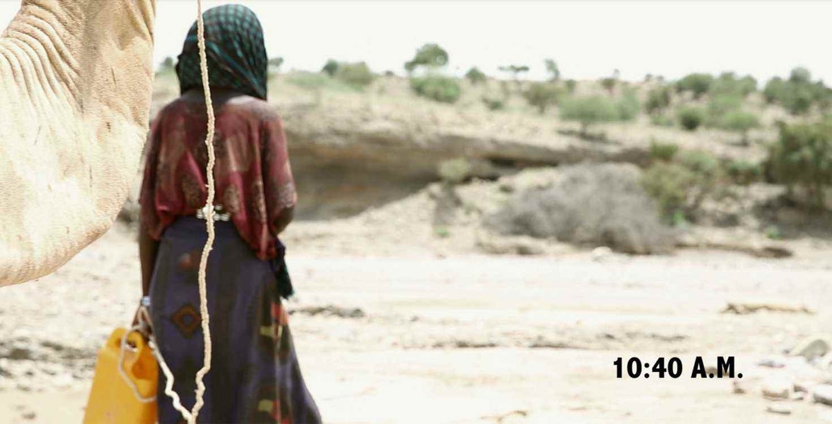 Girl walking to get water