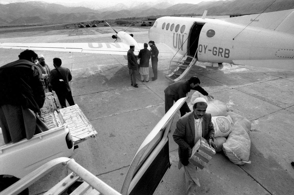 Black and white photo of polio vaccines being delivered in Afghanistan, 2000.