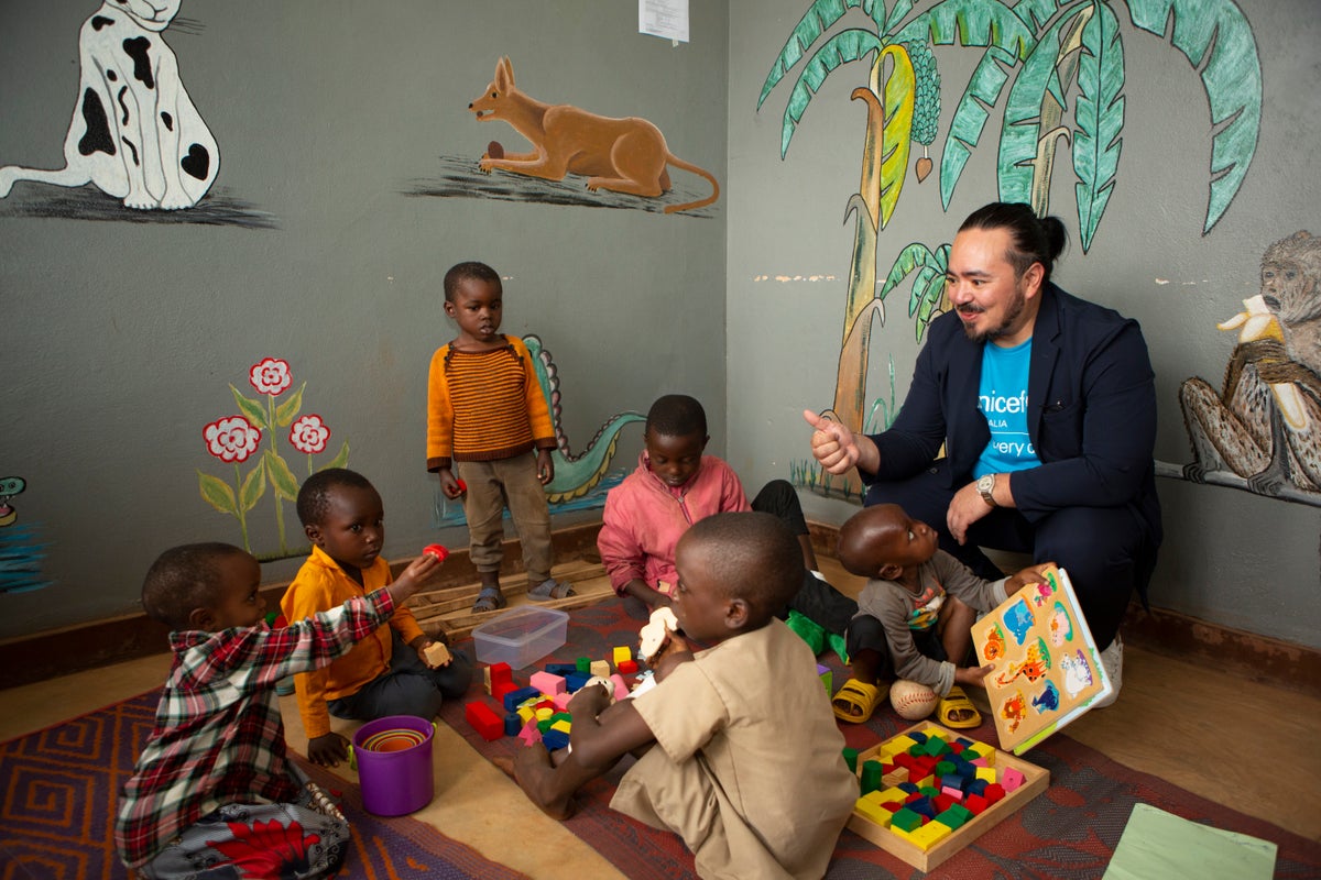 Adam Liaw plays with children recovering from malnutrition.