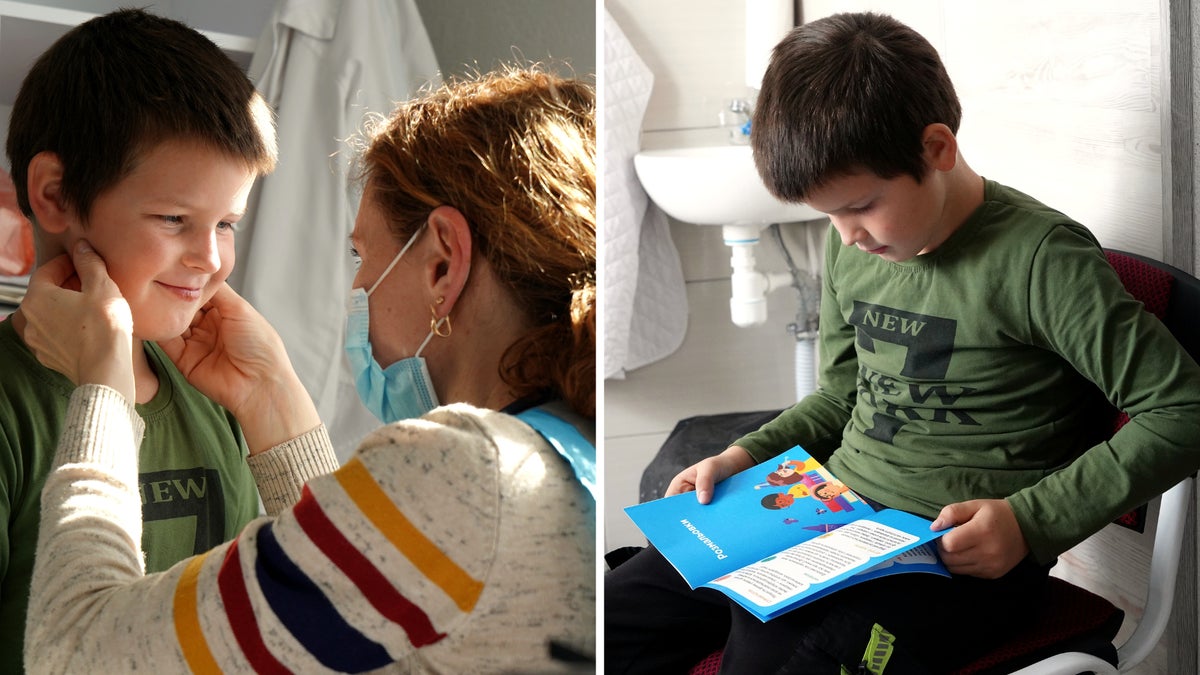 A young boy is checked by a doctor in a mobile health clinic in Ukraine.