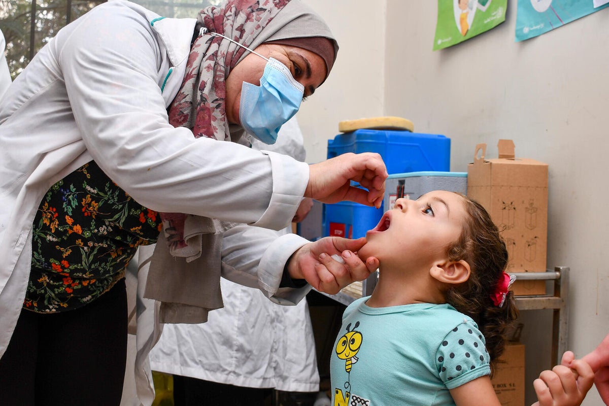 In October 2024, children receive vitamin A in a UNICEF-supported health clinic during a nationwide immunisation campaign.