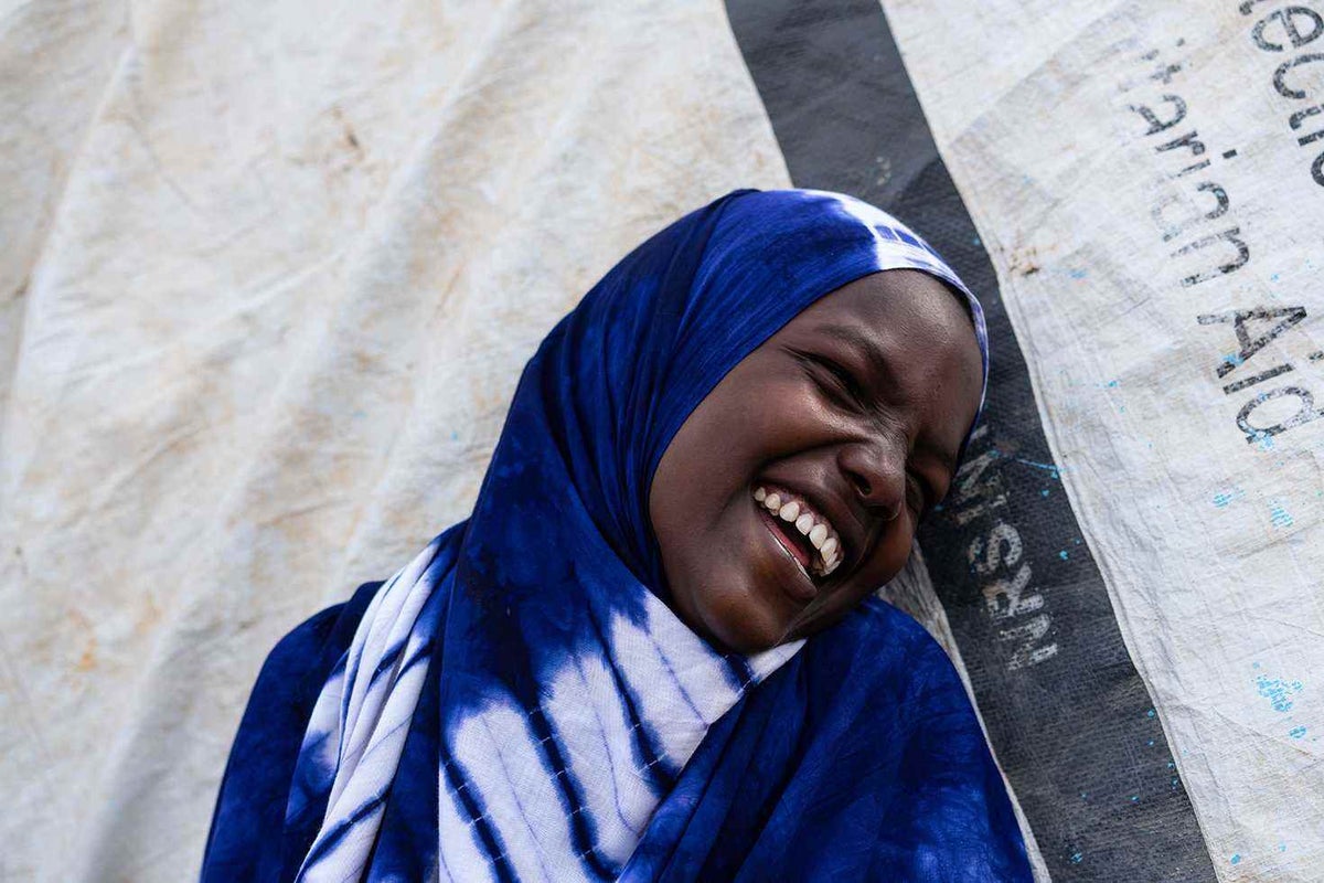 Girls smiles after receiving water