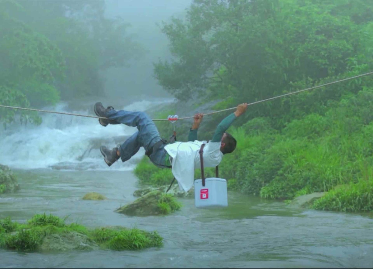 A vaccine carrier is carefully transported across a river in India. It’s a delicate process - the vaccines need to be kept cold, even in tropical parts of the world.