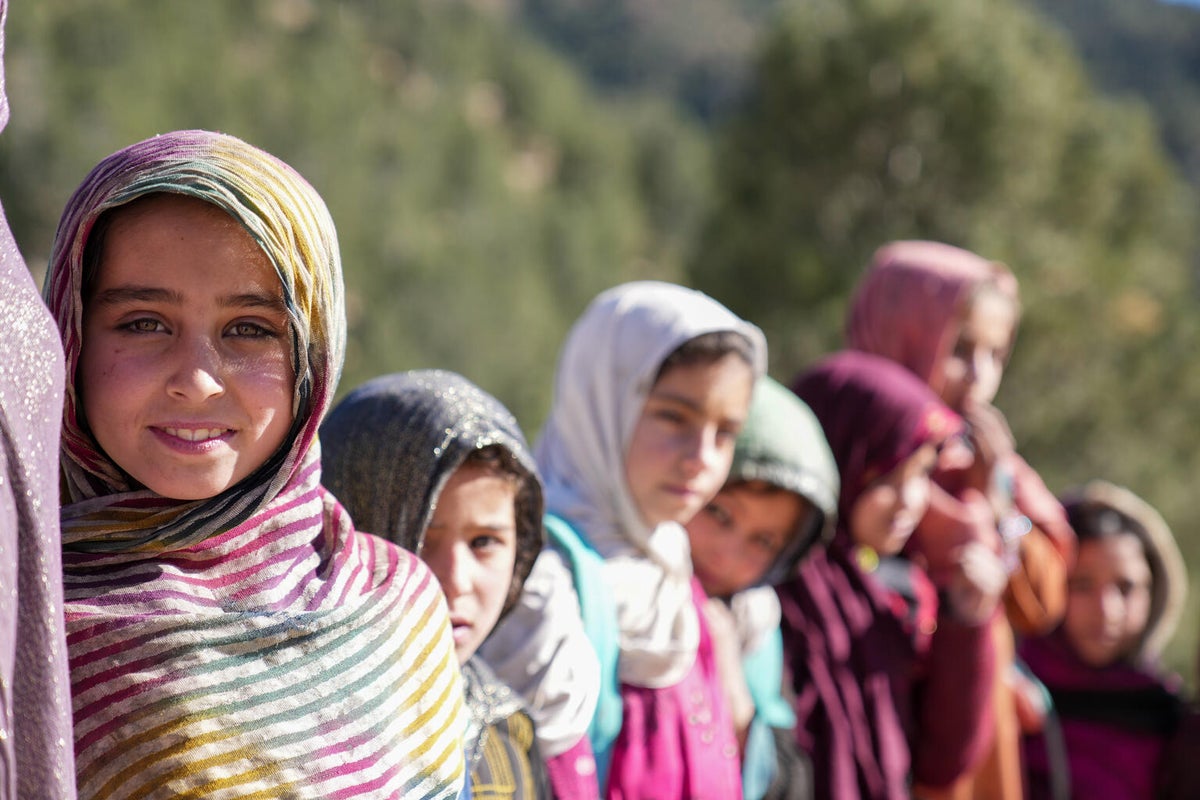 Girls in Afghanistan smiling at the camera