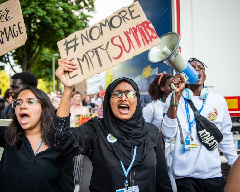 A young activist holder a placard in protest