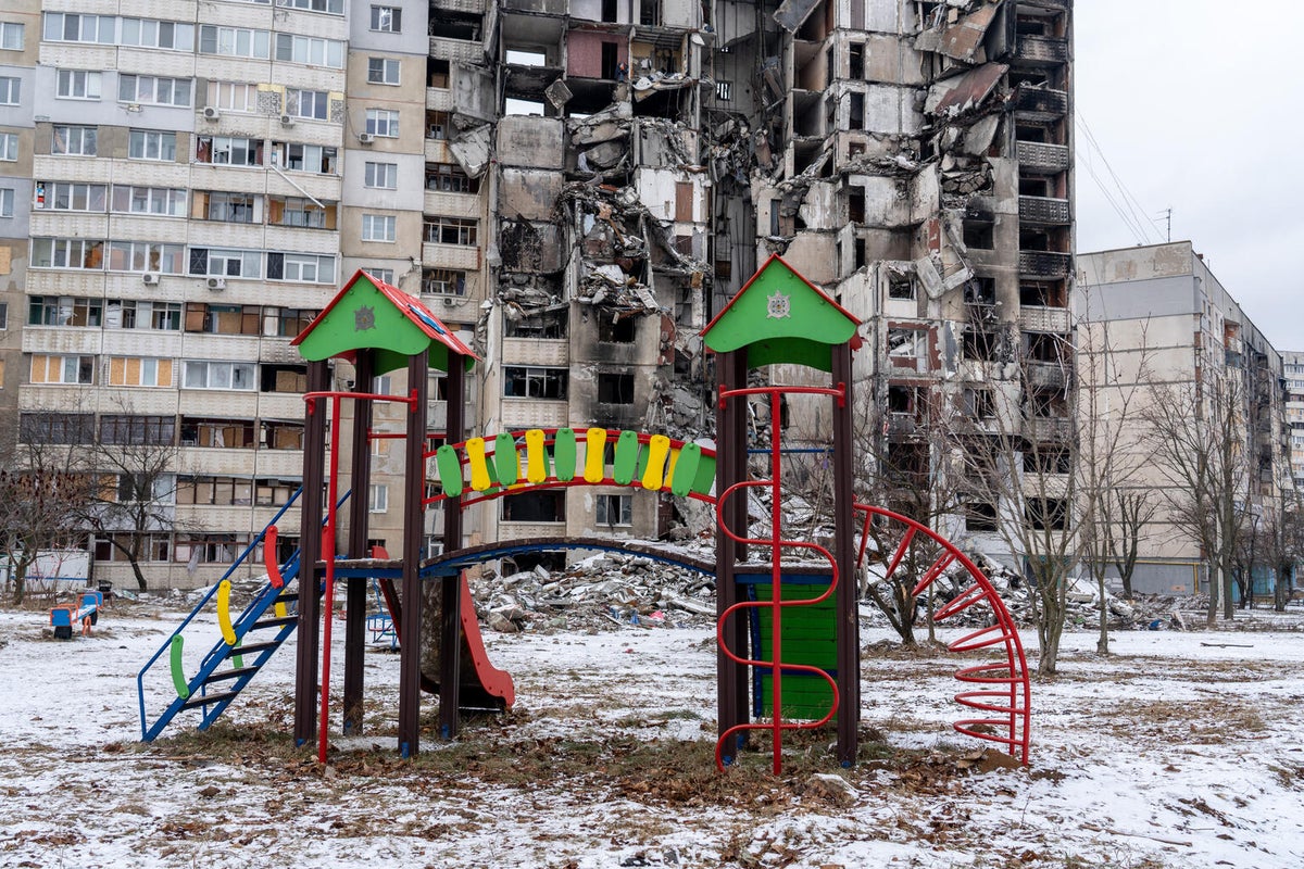 A destroyed apartment building and playground in Ukraine