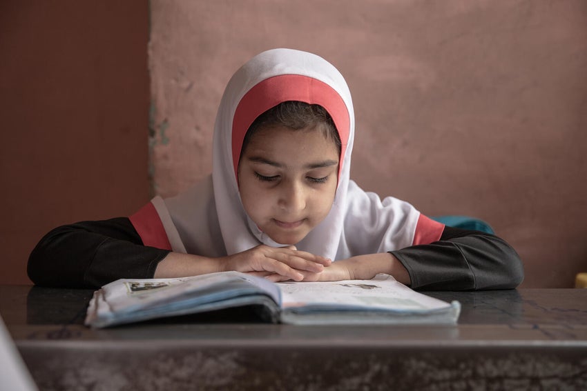 Afghanistan student reading a book