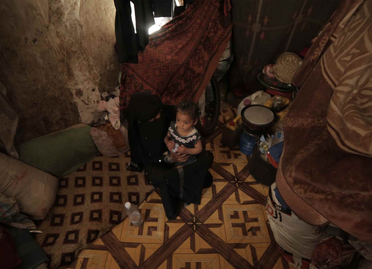 Nour and her mother Souad at their one-room home in Sana’a, Yemen.