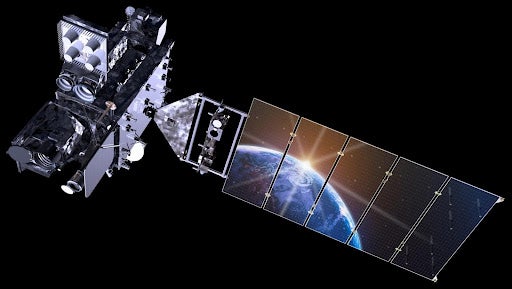 Earth reflected in the panels of the GOES-R satellite in space