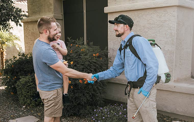 tech greeting a homeowner