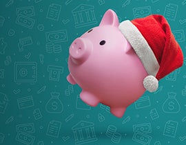 Pink piggy bank wearing a Santa hate on a green background with money iconography.