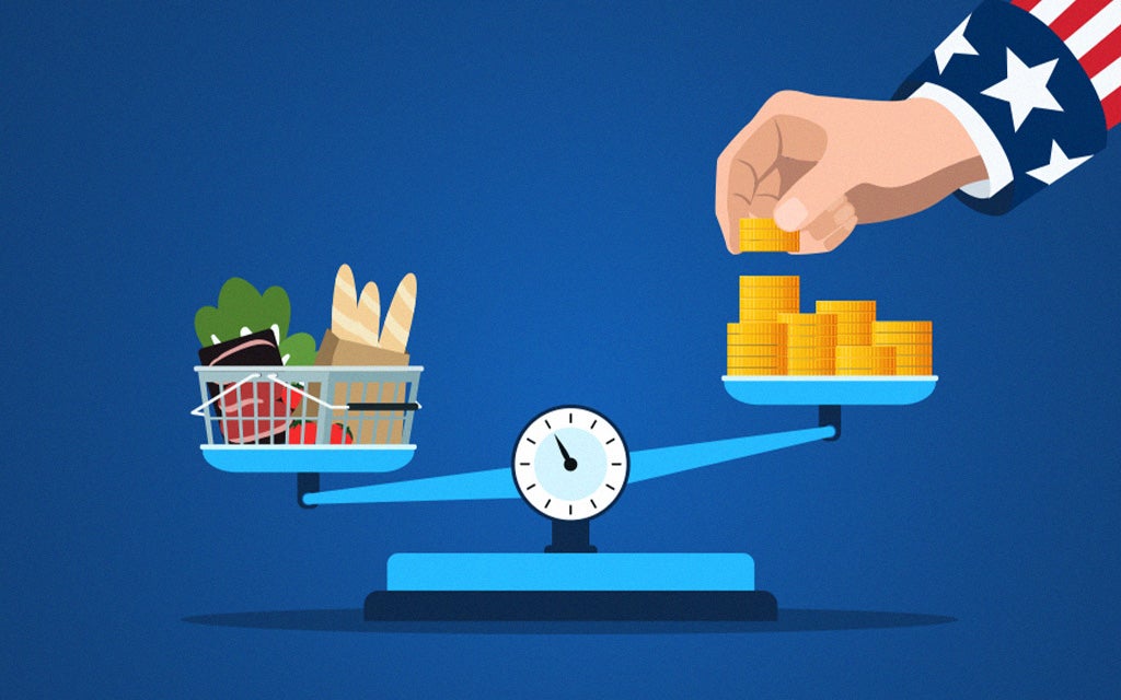 Balance scale comparing grocery costs and stacked coins, representing military retirement COLA and inflation.